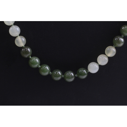 319 - 9ct gold clasped nephrite and carved bowenite necklace (71g) Size P 1/2