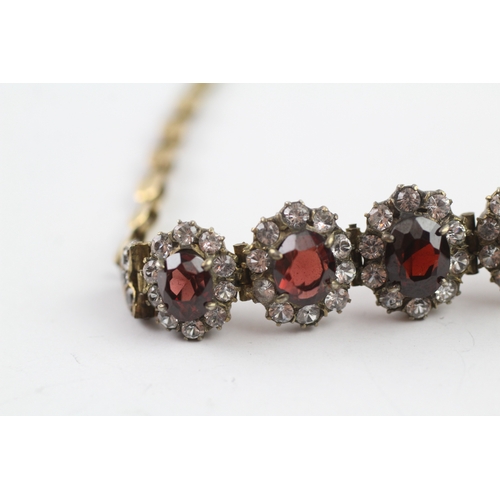 323 - 6ct gold vintage garnet and white sapphire graduated halo bracelet (10.5g)