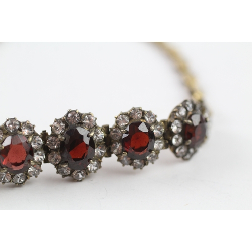 323 - 6ct gold vintage garnet and white sapphire graduated halo bracelet (10.5g)