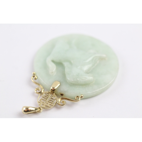 338 - 14ct gold bail carved jade pendant (19.5g)