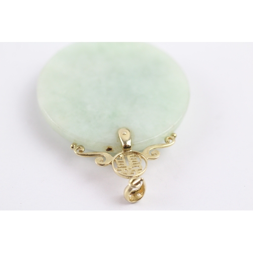 338 - 14ct gold bail carved jade pendant (19.5g)