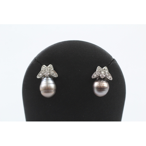 340 - 18ct gold diamond and pearl stud earrings (7.5g)