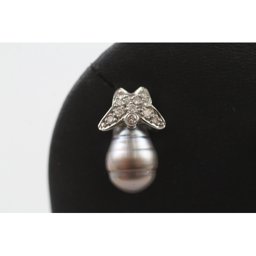 340 - 18ct gold diamond and pearl stud earrings (7.5g)