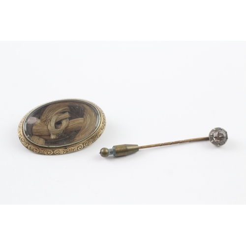 351 - A Victorian gold mourning brooch and a paste set stick pin (9.6g)