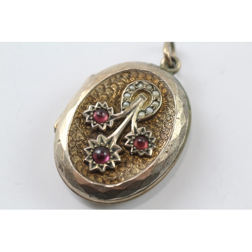 355 - 9ct gold back and front Victorian locket set with garnet and seed pearl (10.7g)