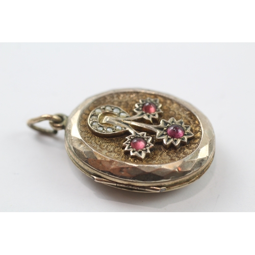 355 - 9ct gold back and front Victorian locket set with garnet and seed pearl (10.7g)