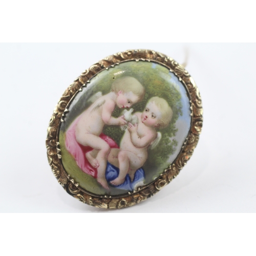 363 - 9ct gold backed painted cherub brooch (7.4g)