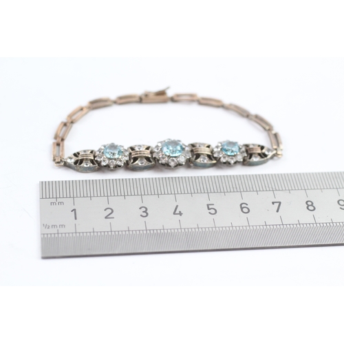 38 - 9ct gold vintage white sapphire and blue zircon bracelet (9.7g)