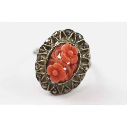 384 - 9ct gold and silver marcasite and coral ring (3.3g) Size I