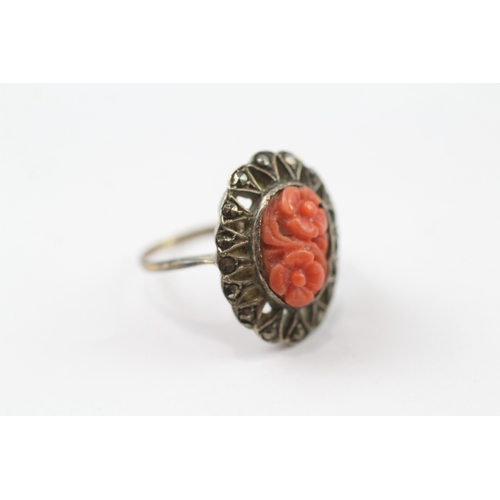 384 - 9ct gold and silver marcasite and coral ring (3.3g) Size I