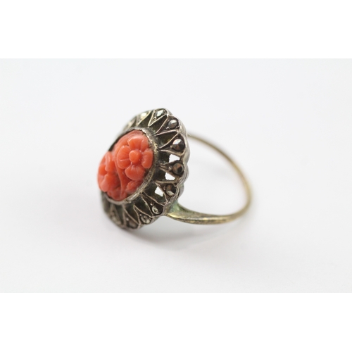 384 - 9ct gold and silver marcasite and coral ring (3.3g) Size I