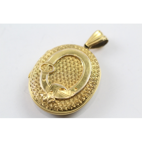 386 - 9ct gold Victorian buckle detail locket (12.1g)