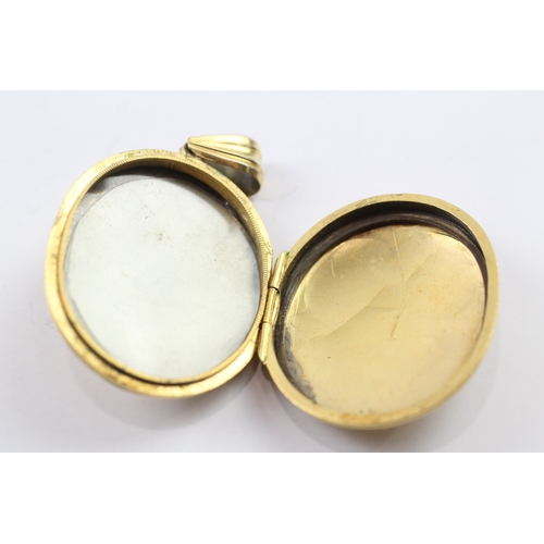 386 - 9ct gold Victorian buckle detail locket (12.1g)