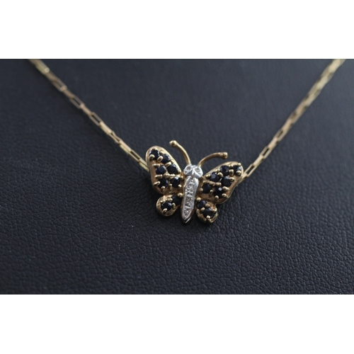 387 - 9ct gold diamond and sapphire butterfly pendant (1.8g)