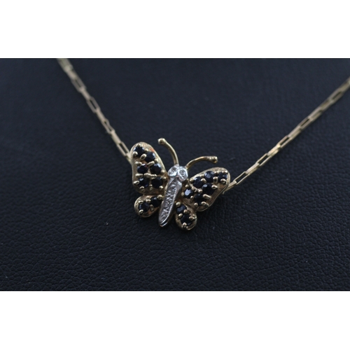 387 - 9ct gold diamond and sapphire butterfly pendant (1.8g)