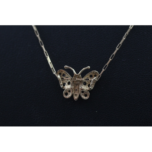 387 - 9ct gold diamond and sapphire butterfly pendant (1.8g)