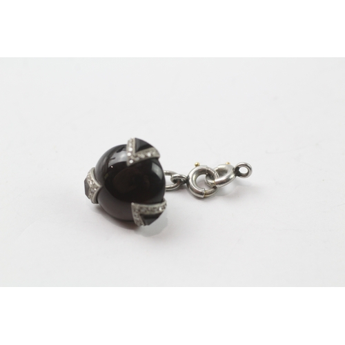 399 - Platinum, onyx and diamond jewellery component (2.9g)