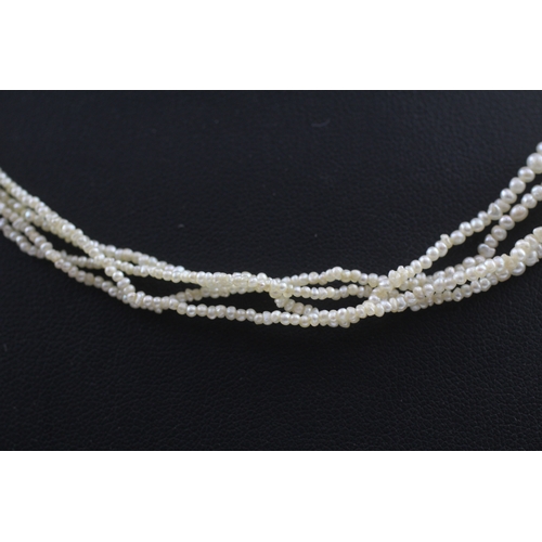 401 - 9ct gold and silver mourning clasp pearl necklace (16.9g)