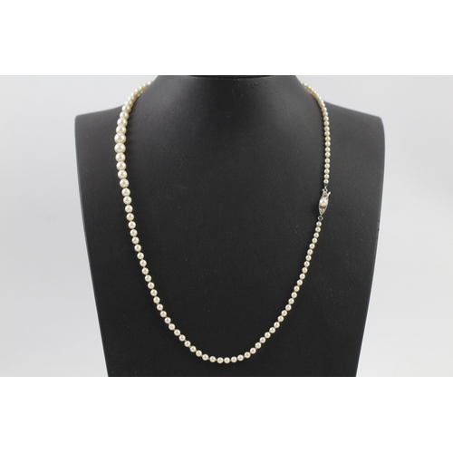 408 - Gold and diamond clasped imitation pearl necklace (11.7g)