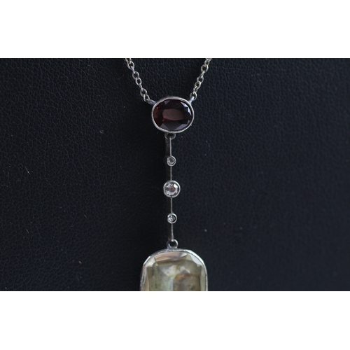 409 - 9ct white gold citrine, garnet and diamond necklace (4g)