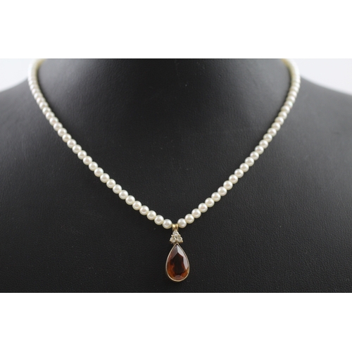 412 - 14ct gold pearl necklace with a diamond and citrine pendant (7.3g)