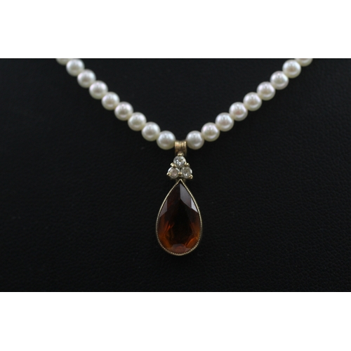 412 - 14ct gold pearl necklace with a diamond and citrine pendant (7.3g)