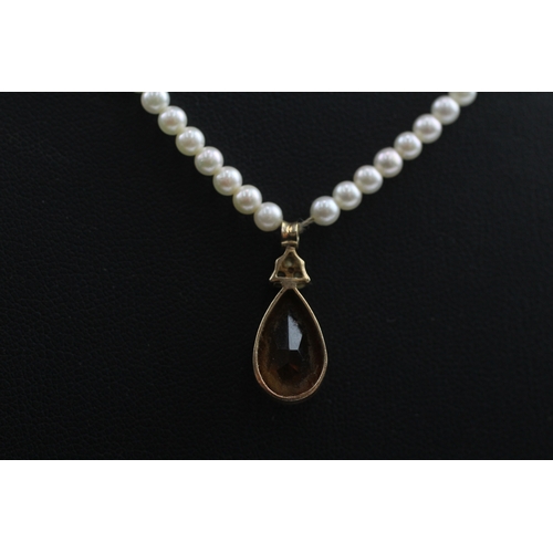 412 - 14ct gold pearl necklace with a diamond and citrine pendant (7.3g)