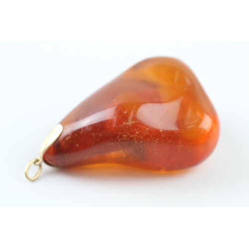 425 - 9ct gold mounted Baltic amber pendant (37.3g)