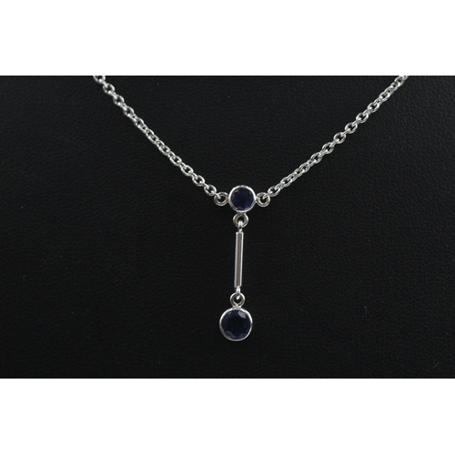 427 - 18ct white gold sapphire drop necklace (5.2g)