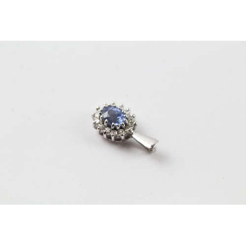 441 - 9ct white gold diamond and sapphire halo pendant (0.7g)