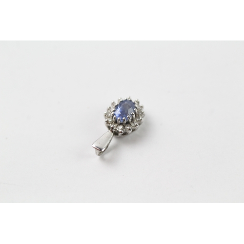 441 - 9ct white gold diamond and sapphire halo pendant (0.7g)