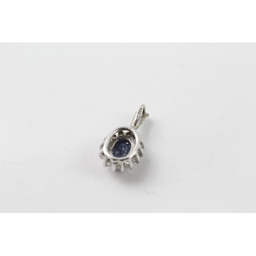 441 - 9ct white gold diamond and sapphire halo pendant (0.7g)