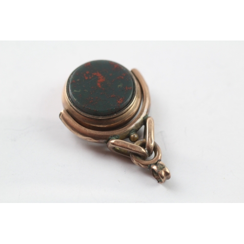 479 - 9ct gold bloodstone and carnelian spinning fob (4.5g)