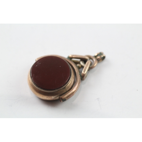 479 - 9ct gold bloodstone and carnelian spinning fob (4.5g)