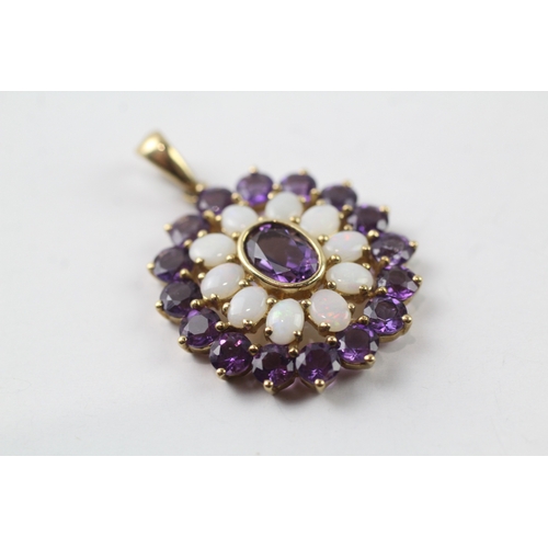 491 - 9ct gold amethyst and opal pendant (3.3g)