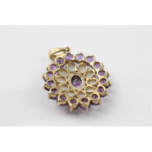 491 - 9ct gold amethyst and opal pendant (3.3g)