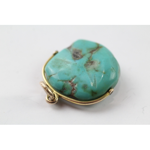 498 - 9ct gold turquoise swivel pendant (7.6g)