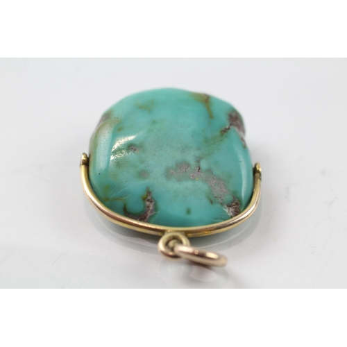 498 - 9ct gold turquoise swivel pendant (7.6g)