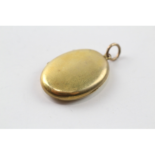 514 - 9ct gold back and front locket (4g)