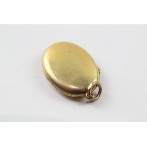 514 - 9ct gold back and front locket (4g)