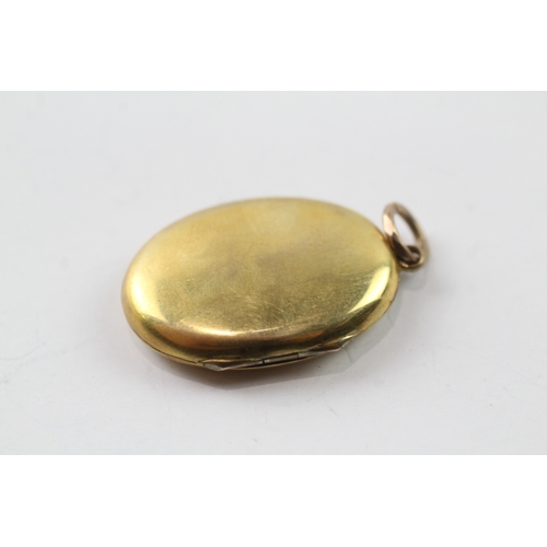 514 - 9ct gold back and front locket (4g)