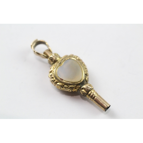 515 - 9ct gold cased watch key fob set with chalcedony and a glass panel (2.9g)