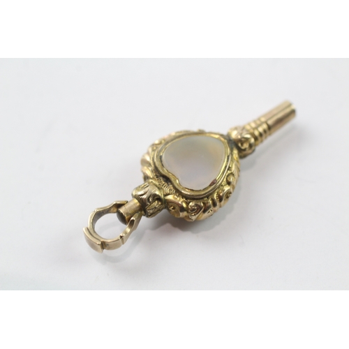 515 - 9ct gold cased watch key fob set with chalcedony and a glass panel (2.9g)