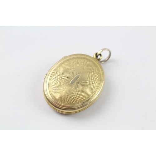 522 - 9ct gold back and front locket (7g)