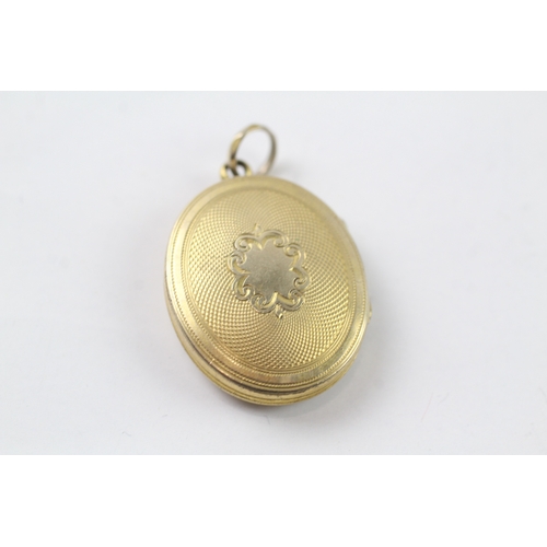 522 - 9ct gold back and front locket (7g)