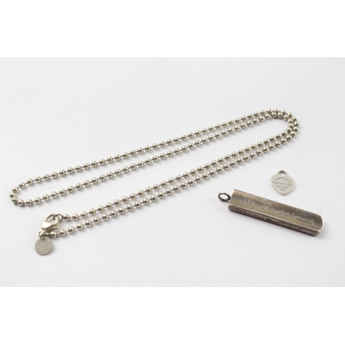 565 - A silver chain and two pendants by Tiffany and Co (19g)