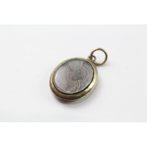 567 - 18ct gold mourning locket with anchor design (1.6g)