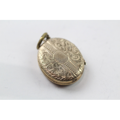 570 - 9ct gold back and front locket (4.6g)