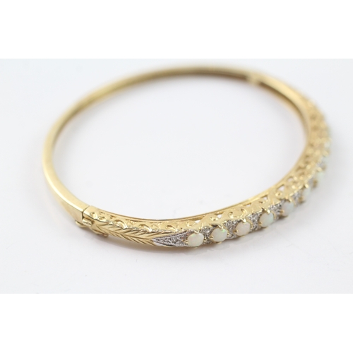 65 - 9ct gold opal and diamond set bangle (9.9g)