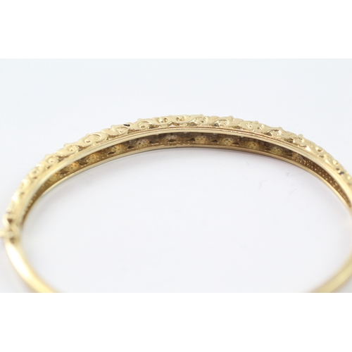 65 - 9ct gold opal and diamond set bangle (9.9g)